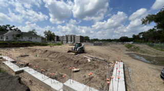 Heavy equipment assists with interior backfilling at the Chapel View Care Center site.