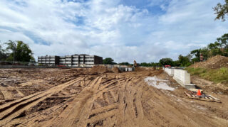 View across Chapel View Care Center construction site with completed concrete slabs and foundation work, September 2025.